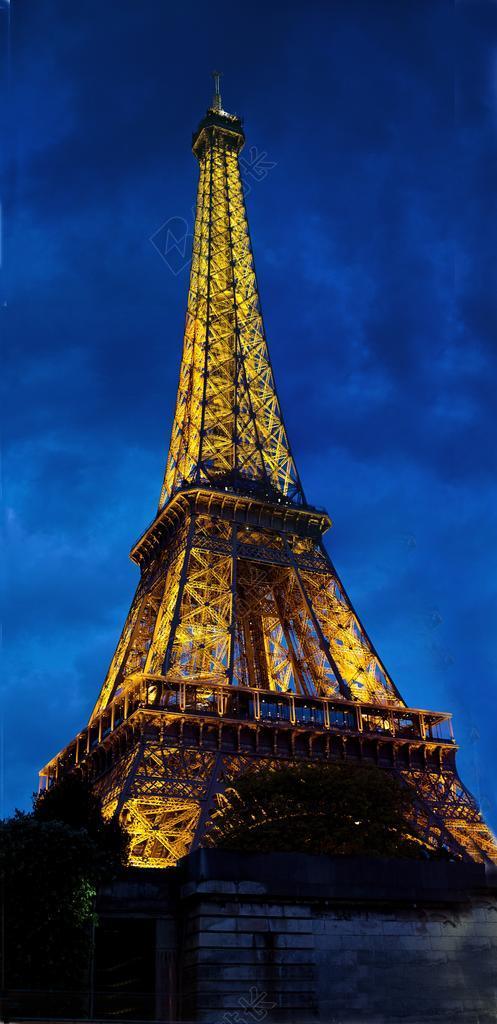 黄蓝建筑雄伟仰视下的发光的铁塔建筑设计景点旅游摄影街拍背景图片