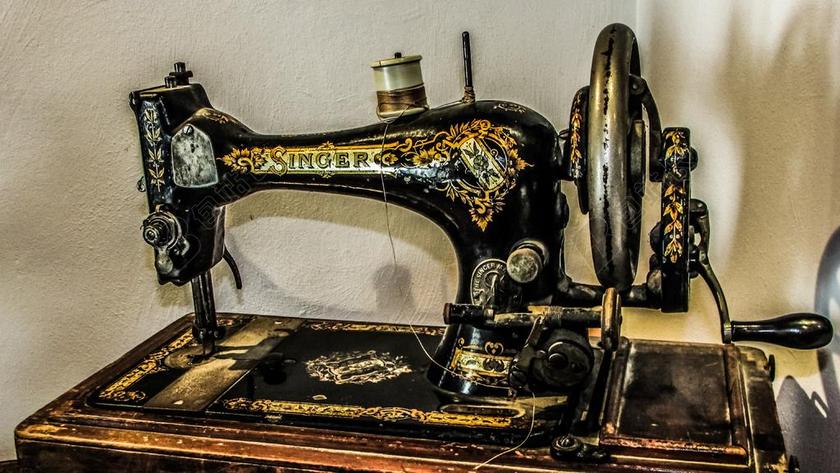 黑色金色花纹古老古董缝纫设计缝纫机手动复古背景图片