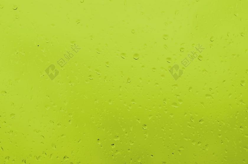 黄色水滴晶莹黄色背景上的水滴水珠背景图片