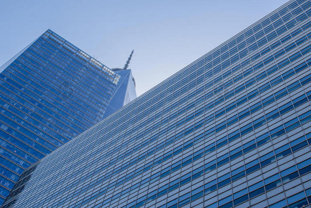 蓝色建筑宏伟玻璃外墙高楼建筑设计背景图片