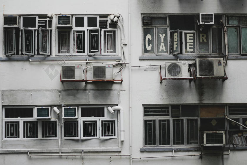 灰色建筑杂乱窗户空调等墙面建筑设计背景图片