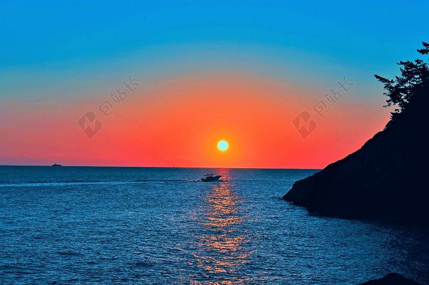 蓝色唯美海边日出日落背景图片