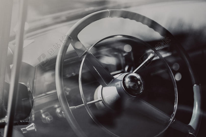 灰黑汽车简约车内的方向盘近照汽车配件宣传背景图片