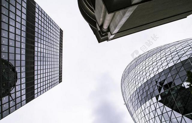 灰白建筑现代创意仰视下的建筑风景建筑设计背景图片