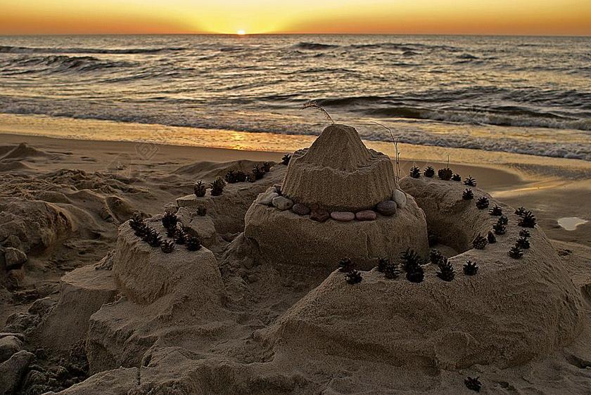 自然风景沙滩上的城堡背景图片