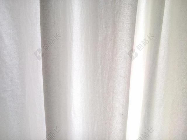 白色布料轻柔飘动的窗帘窗帘布料展示背景图片