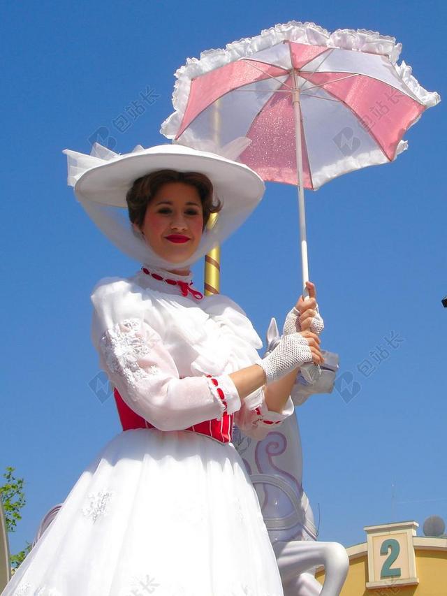 摄影清新迪士尼乐园撑伞的女士背景图片