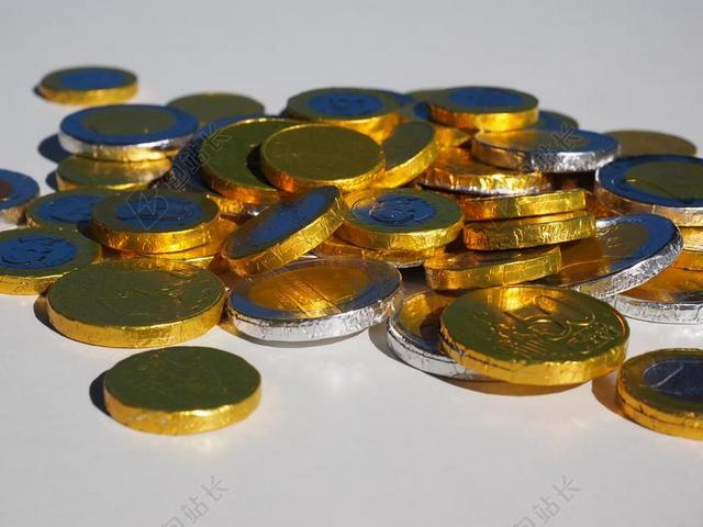 金融商务堆积的的钱币背景图片