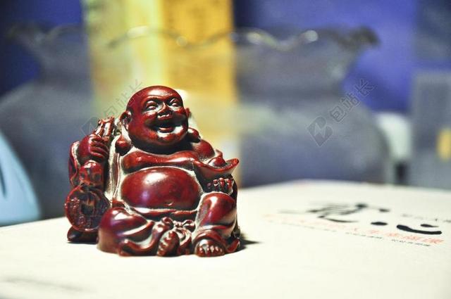 弥勒佛 雕塑 书
