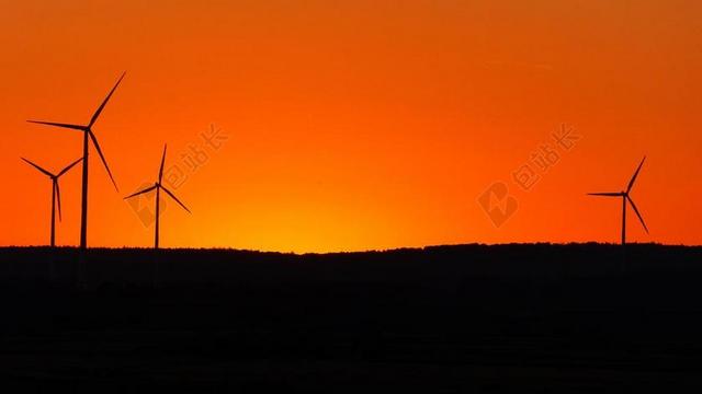 橙色工业现代风车发力站夕阳西下宣传背景图片