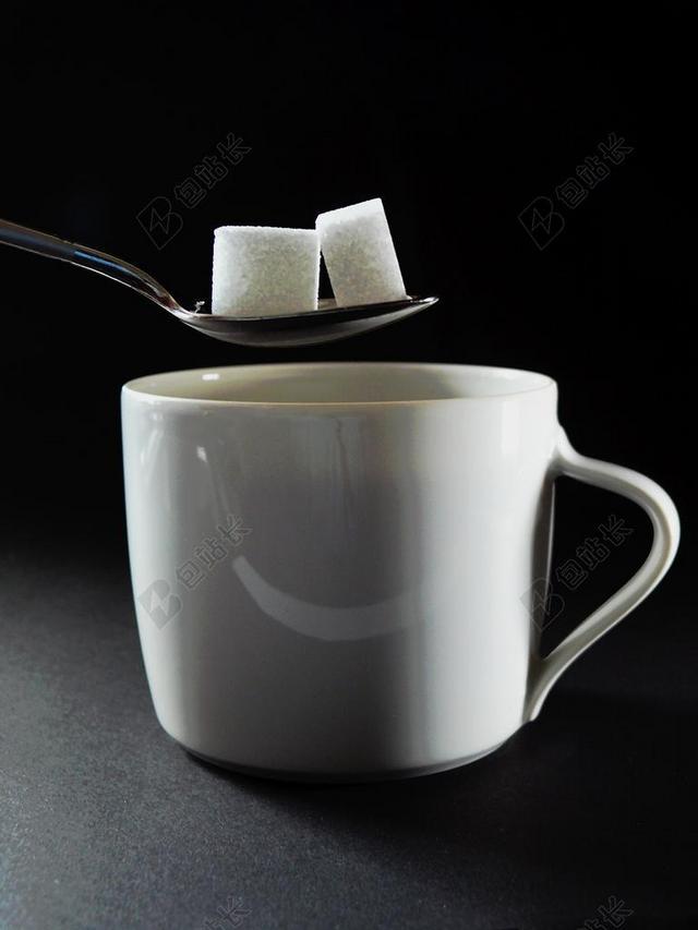 餐饮唯美给咖啡加糖背景图片