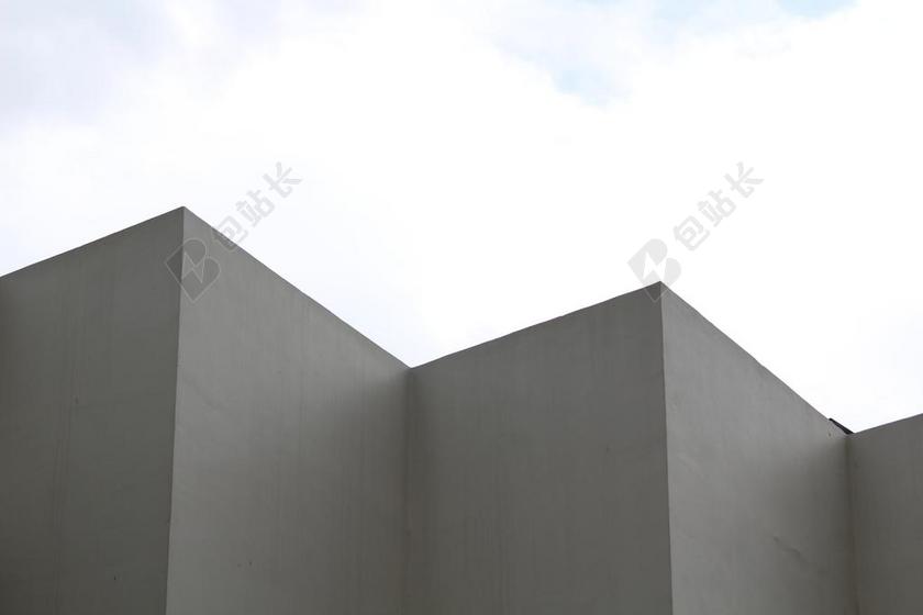 黑白建筑经典白云下的黑色折叠建筑一角建筑设计背景图片