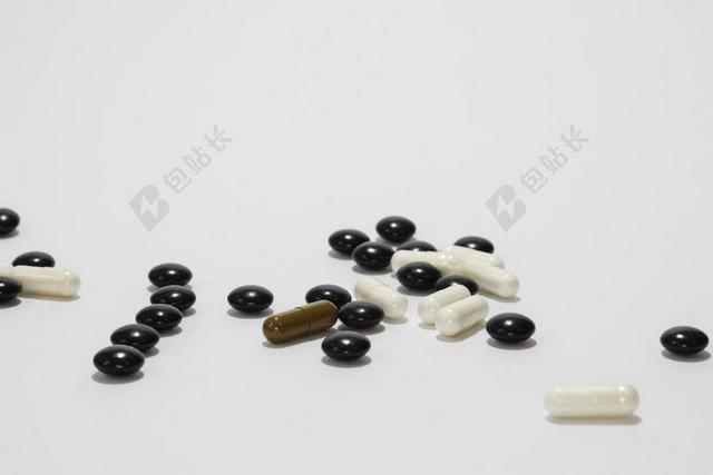 医学医疗不同形状的药丸背景图片