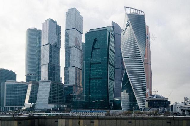 深蓝色旅游唯美高楼大厦城市背景图片