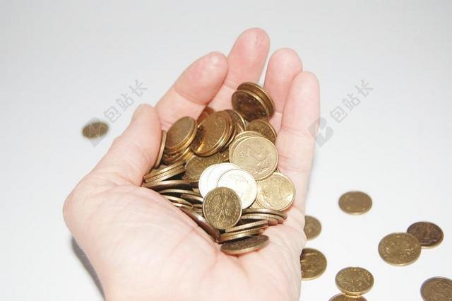 黄色金融鲜明手上的金币钱币储存交易商贸背景图片
