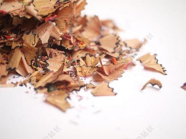 黄白摄影丰富堆积的铅笔笔屑文具创意背景图片
