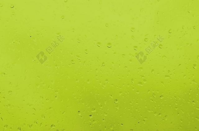 黄色水滴晶莹黄色背景上的水滴水珠背景图片