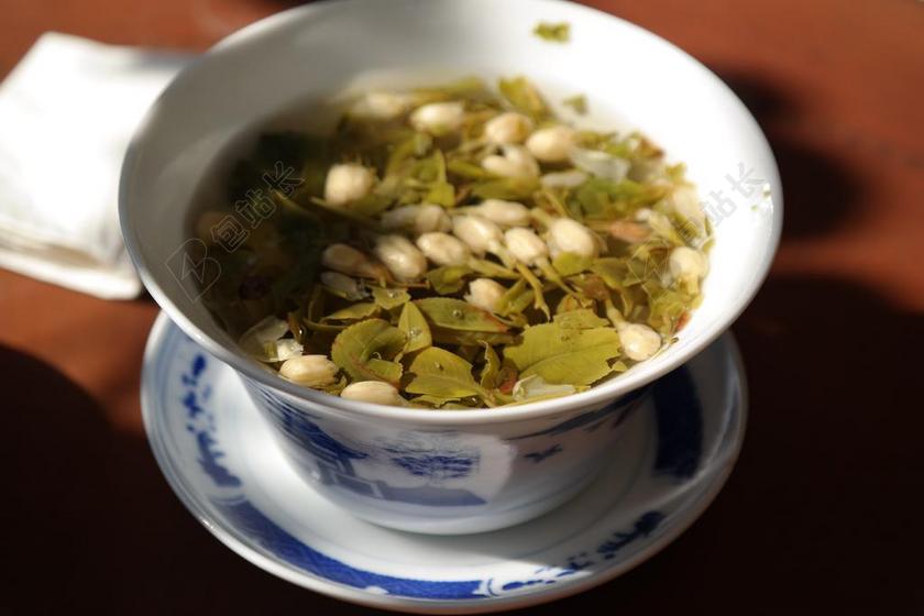 餐饮食物茶水茶杯里面的茶水饮料茶道背景图片