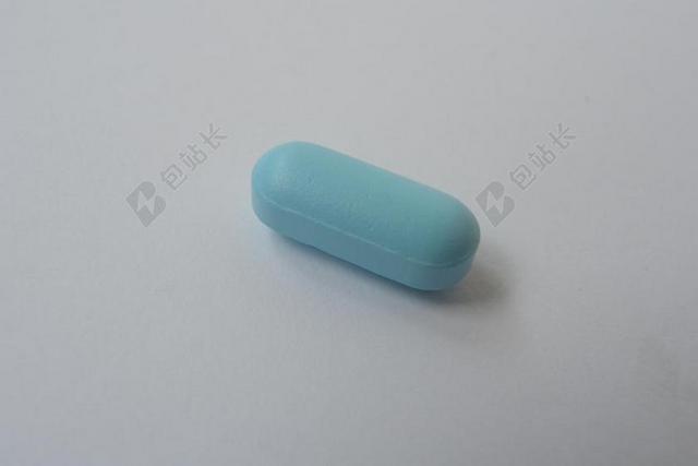 蓝色医疗特写蓝色的药丸背景图片