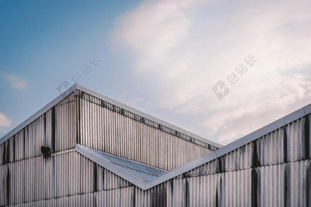 建筑创意天空下的外墙墙面建筑设计背景图片
