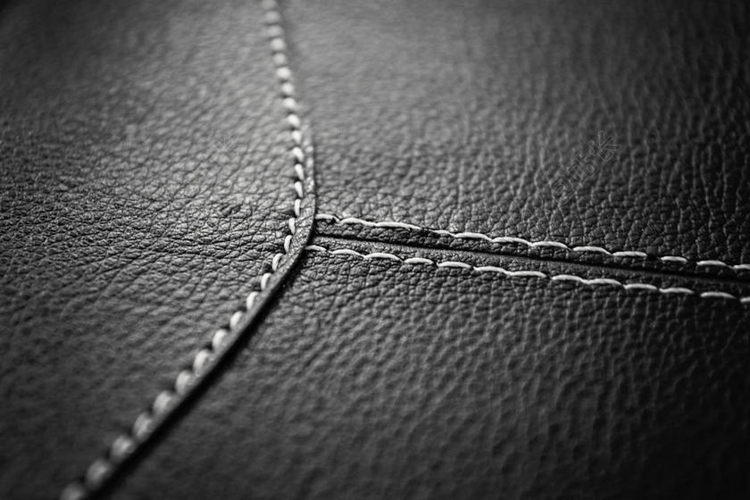 黑色的皮革和白色的线背景图片