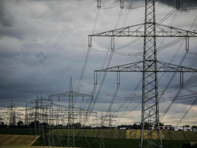 灰色能源科技搭建输电高架传输高压电背景图片
